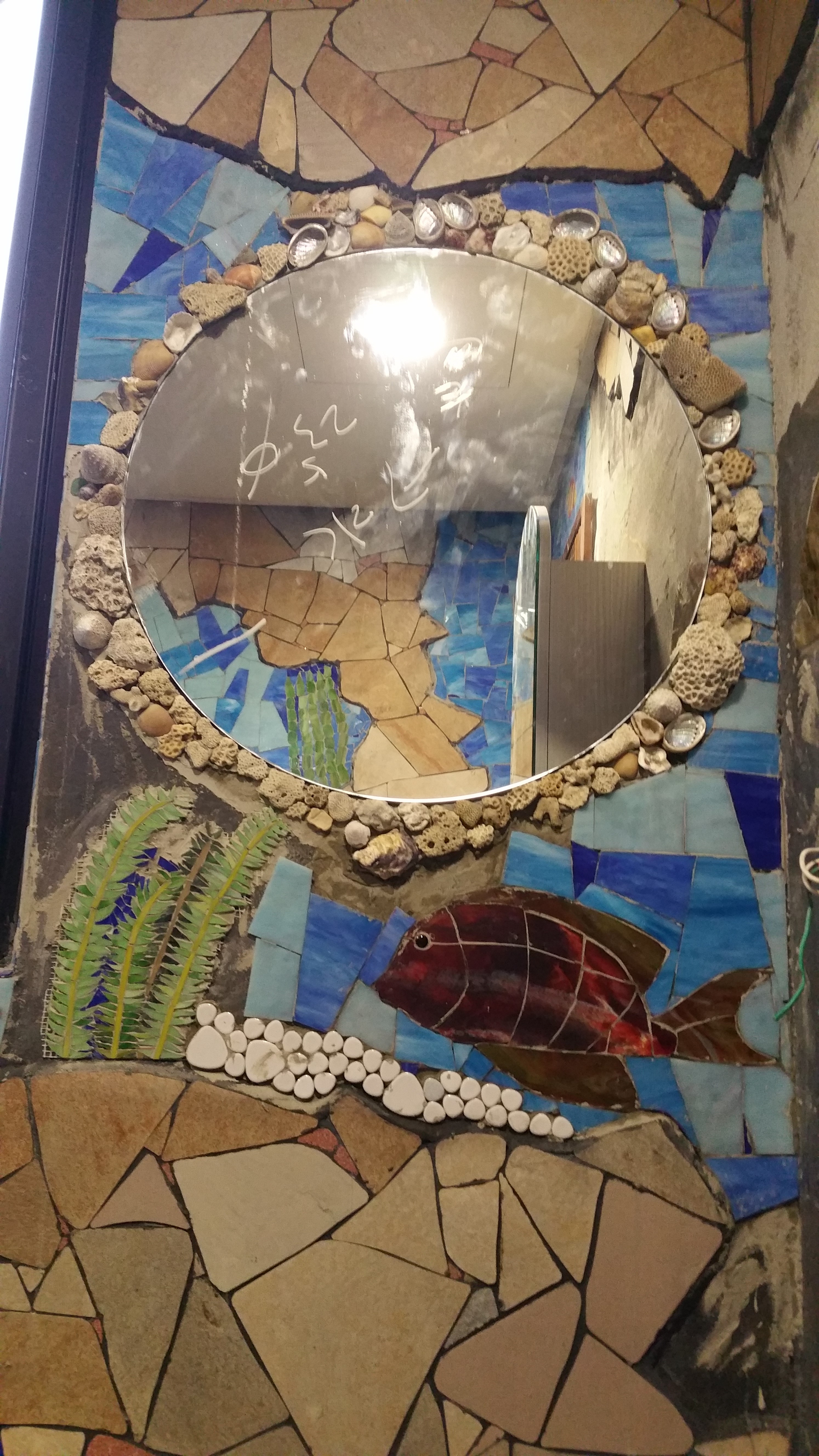 Mirror with shells and dead coral found on the beach @FulongBeach