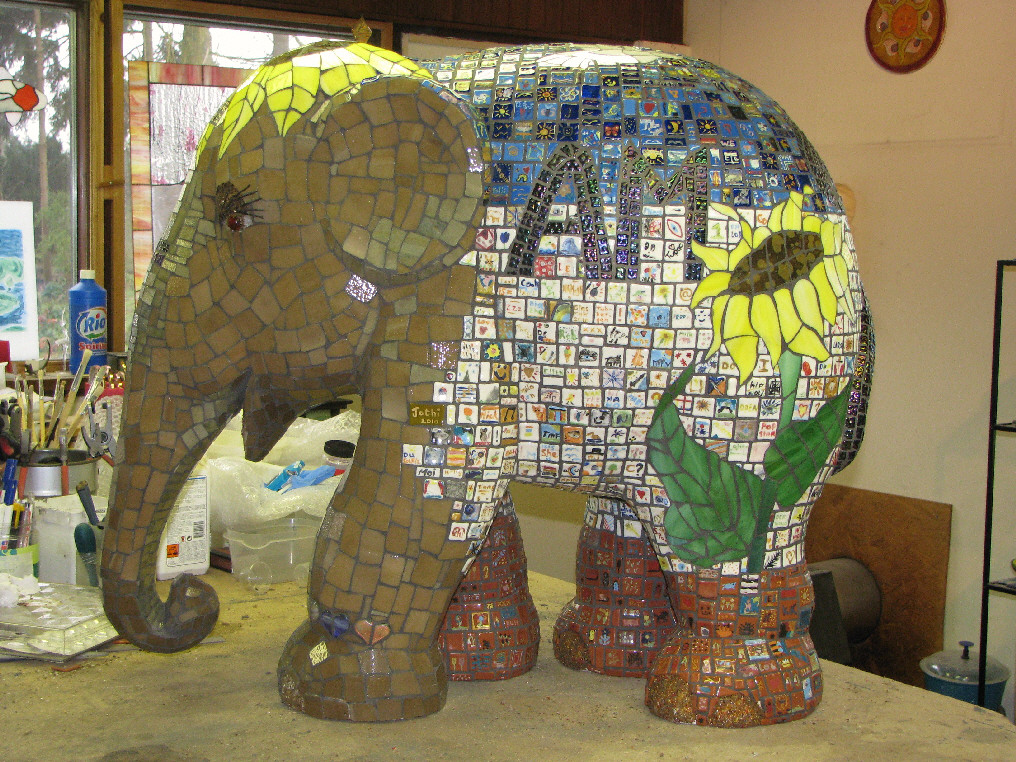 Little Sister left
Elephant Parade Copenhagen 2011
Glass 'tiles' painted by kids, then kiln-fired